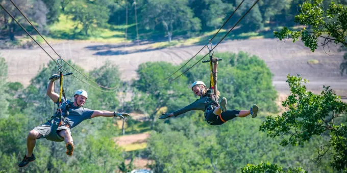 Guests ziplining at Ancient Peaks winery in Santa Margarita, California