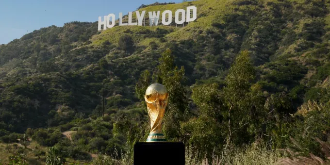 FIFA World Cup Trophy in front of the Hollywood Sign in California